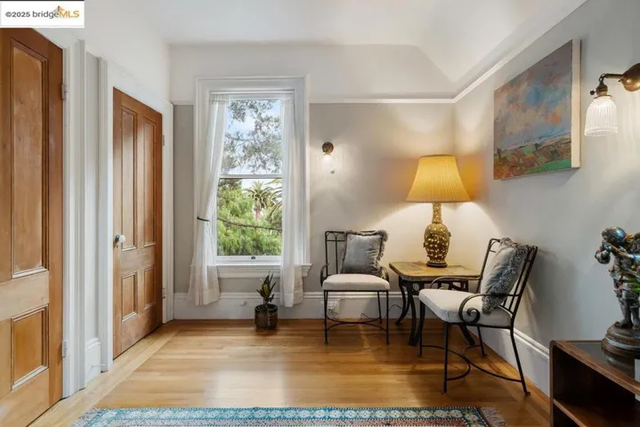 Sitting room with light wood-style flooring and baseboards