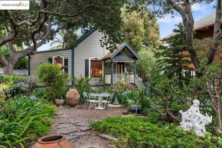 Back of property featuring covered porch