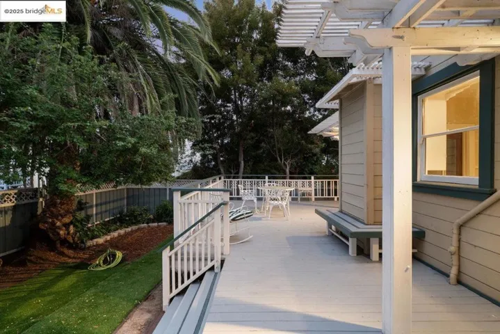 View of patio / terrace with a deck and outdoor dining area