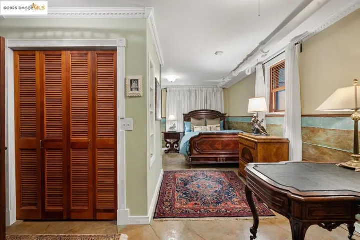 Bedroom featuring a closet and light tile patterned floors