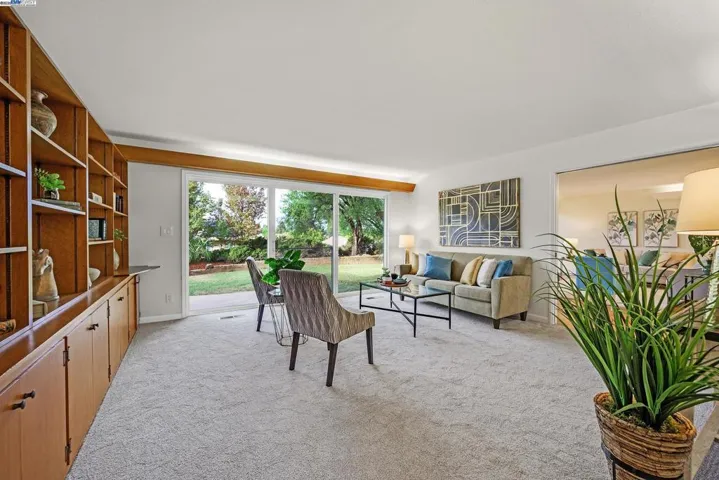 Family room with built in shelving and cabinets.