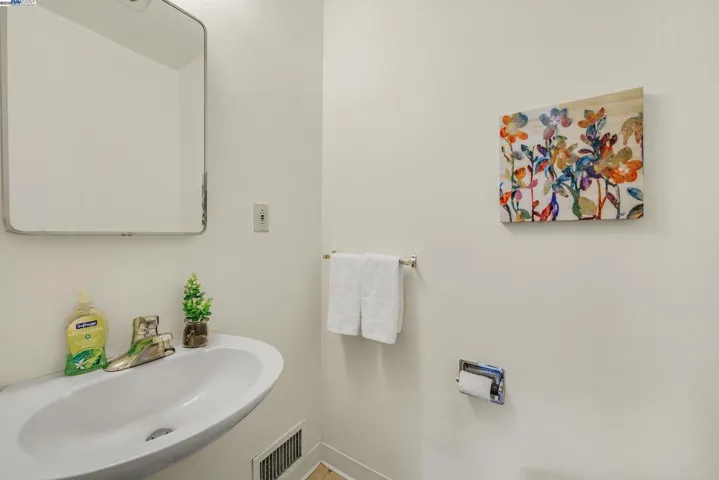 Half bathroom off of kitchen and laundry room.