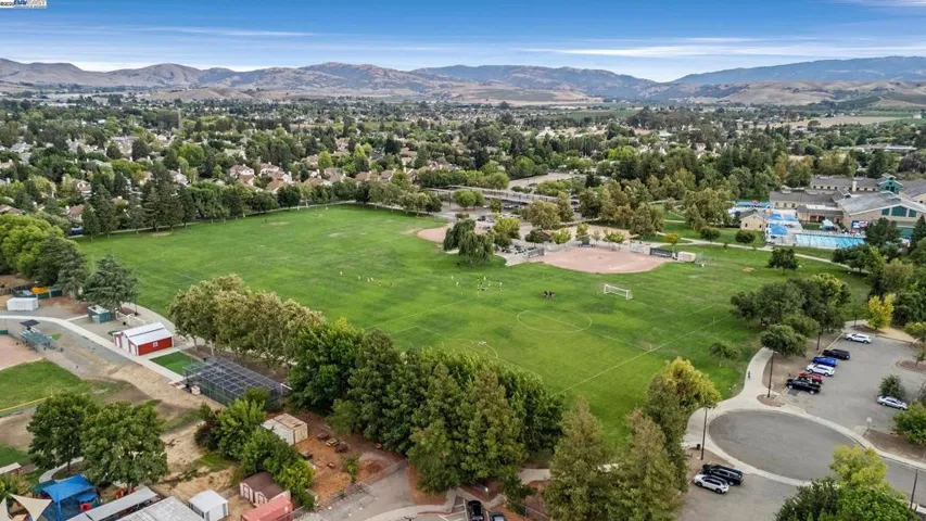 Short walk down the street to the park, walking path and baseball fields.