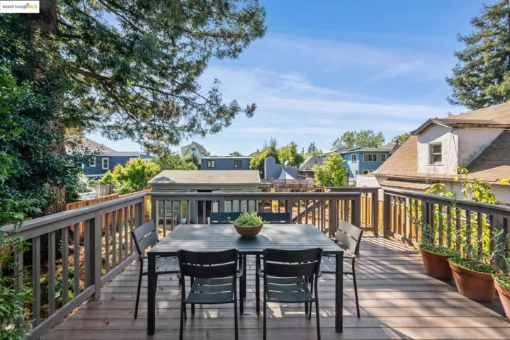 Deck featuring a residential view and outdoor dining space