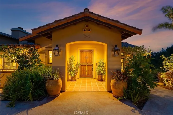 Two of the six gas lights at front entry to home