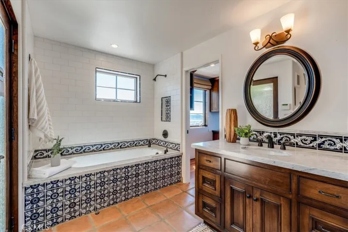 Bathroom off office, bedroom, and library.