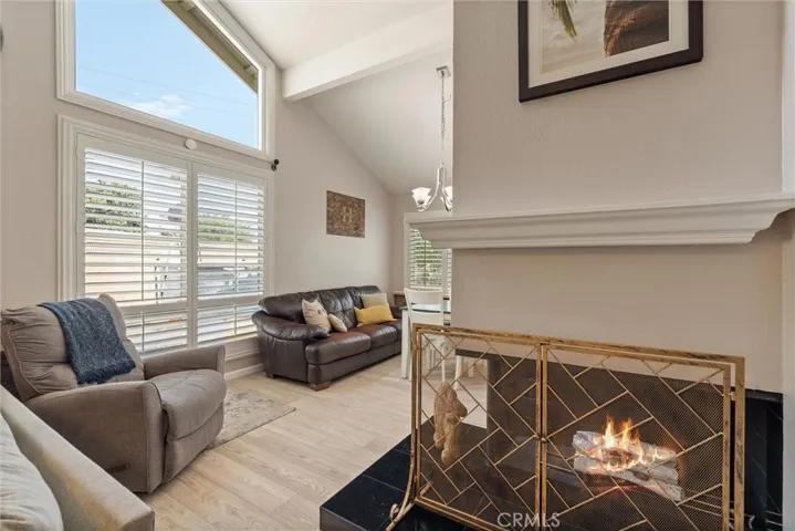 Light and bright living room with gas fireplace.