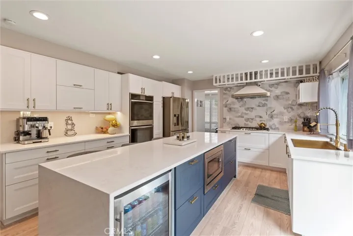 Freshly remodeled chefs' kitchen with fabulous finishes and built in wine fridge.