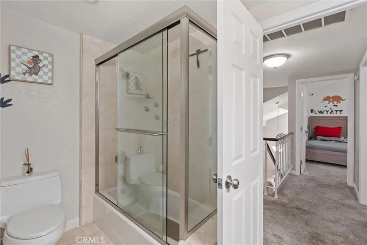 Upstairs guest bath shower.