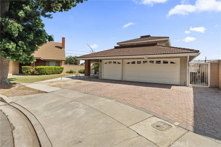 Oversized driveway for toys or multiple cars.