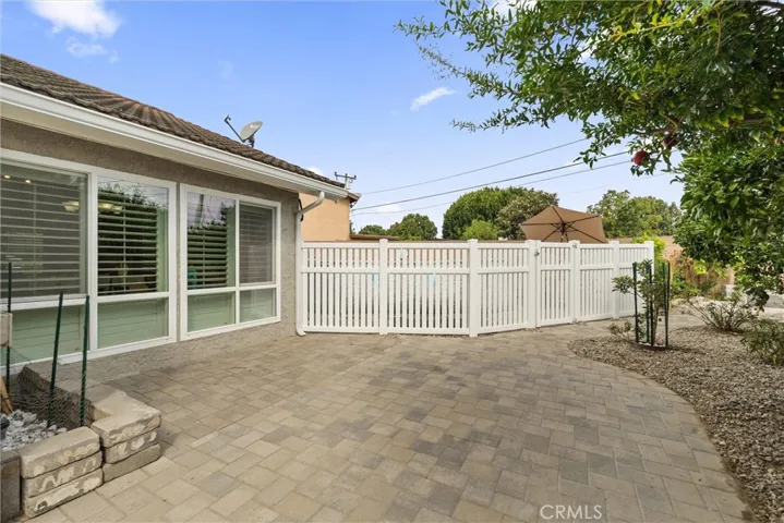Newer vinyl fencing surrounding above ground pool.