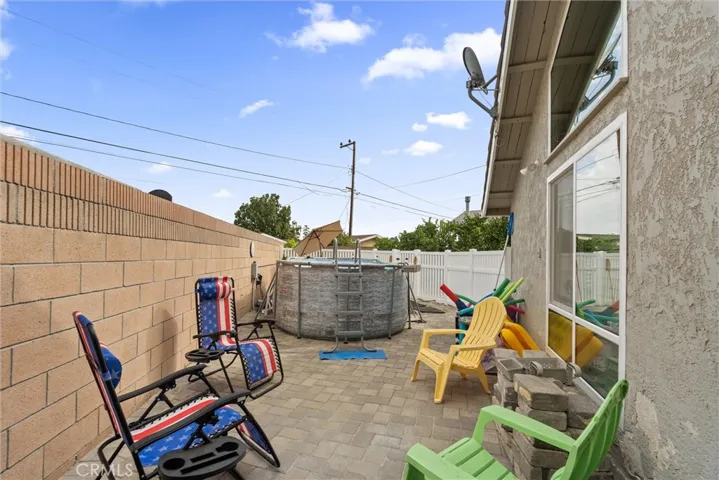 Large side yard by pool for pool toys or sunbathing!