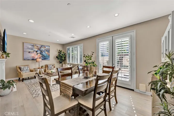 Great room style living space with recessed lighting and lots of natural light