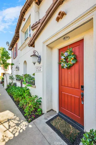 Entry door of this 2-sory end unit condo in the exclusive gated community of Solana Walk