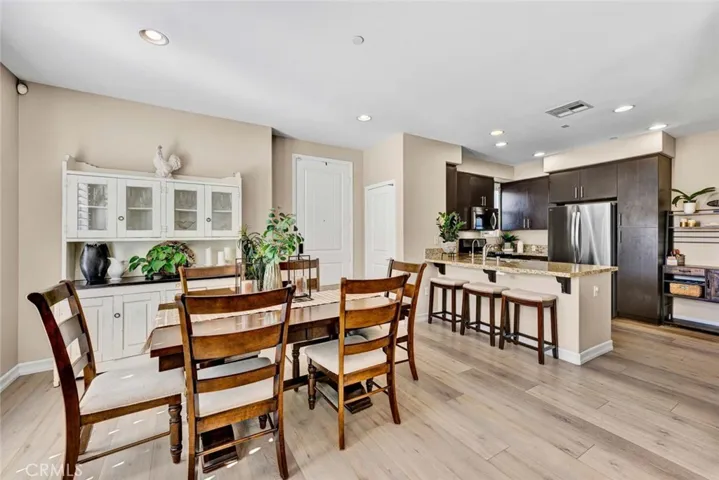 Designer paint, high baseboards, recessed lighting, and luxury wood vinyl flooring