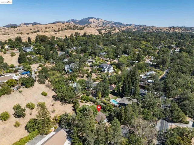 Aerial overview of property's location with a mountainous background
