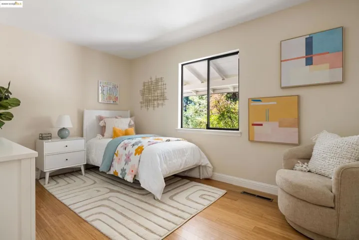 Bedroom with baseboards and light wood-style floors