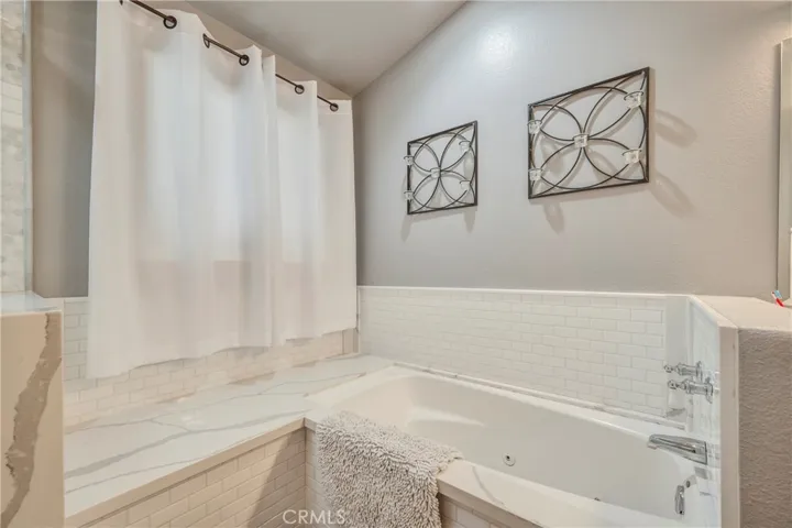 Jetted soaking tub in primary bathroom