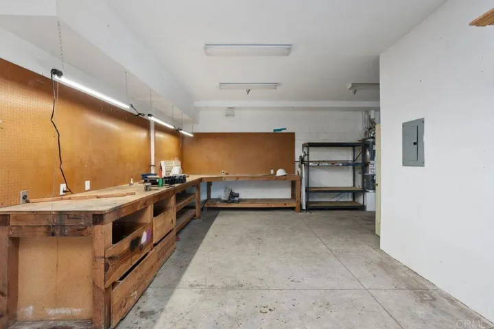 huge area for whatever you desire with several 220 electric plugs & fluorescent lights.