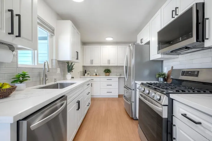 All new cabinets, stainless appliances & quartz countertops.