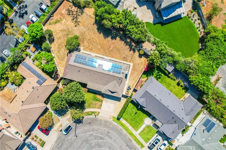 Beautifully positioned on the curve of a quiet 31-home square, the house is setback and angled to maximize privacy. The lot is huge! 17,608 Sq.Ft.