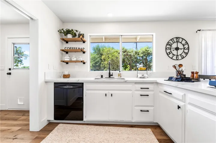 View of the Kitchen and the adjacent Laundry room to the left
