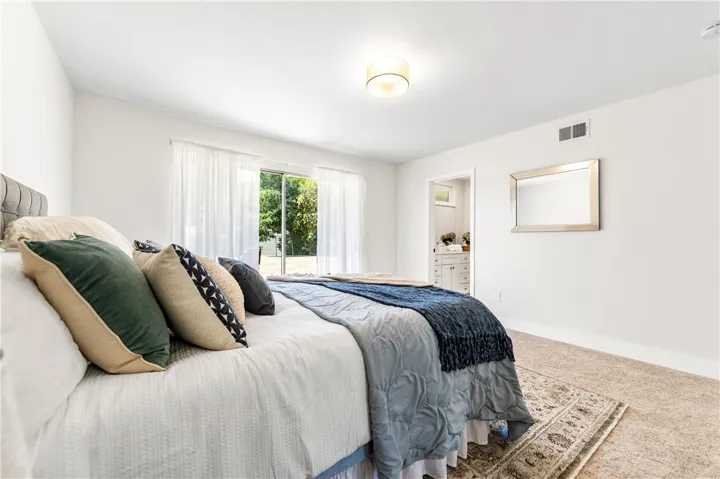 Primary Bedroom with access to the backyard.