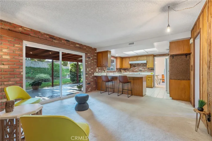 Den looking into Kitchen