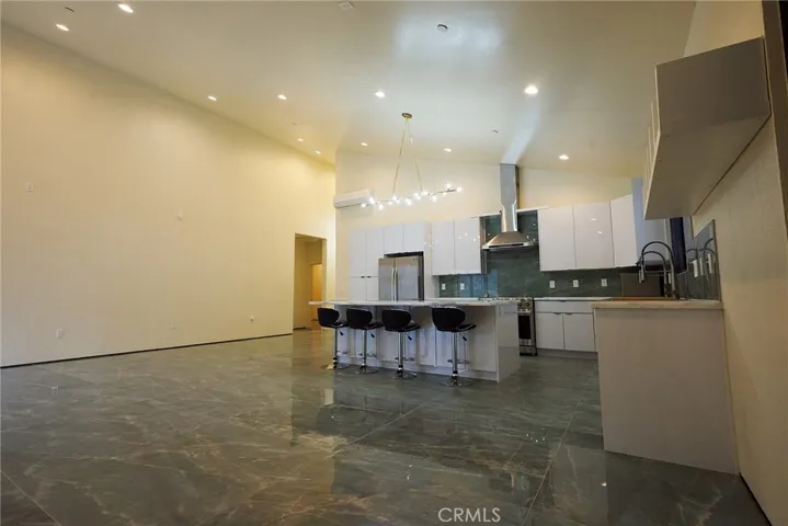 Custom Kitchen w/ 18,000 BTU heat pump w/A/C AND 21' high seperation wall