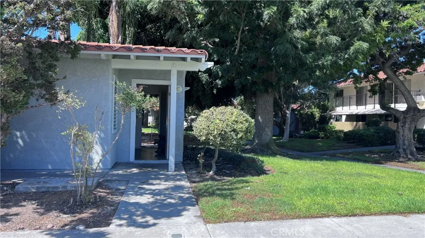 Laundry room is next to carport.