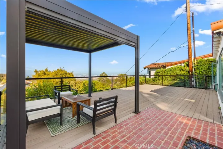 Stunning views to the city and ocean.The lush lawn and landscaping add the home's charm.