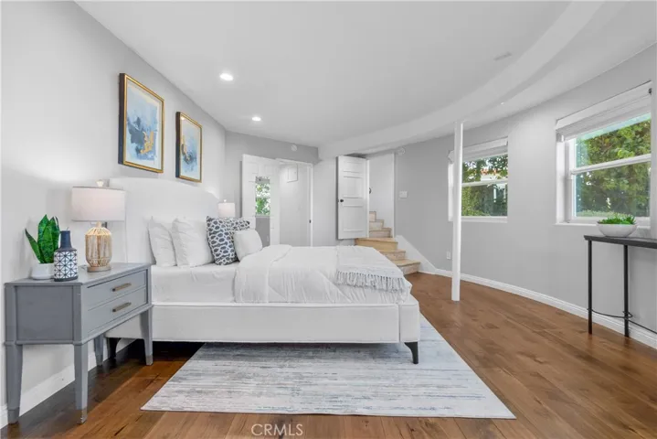 The elegant primary bedroom is a spacious suite where the Art Deco design continues.