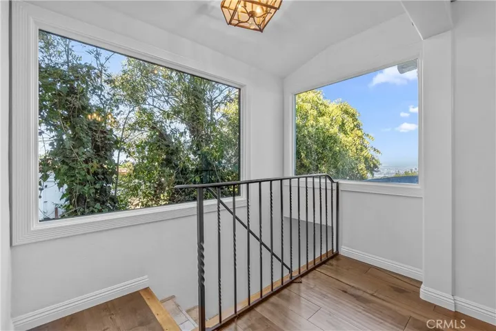 The stairwell to the entry for the private Primary Suite.