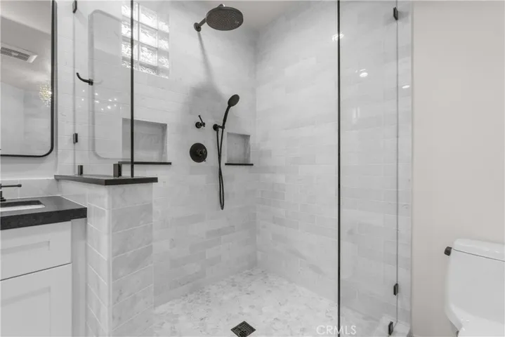 The spa-like bath is a relaxing retreat with gorgeously styled features.