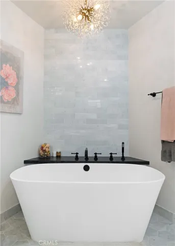 The spa-like bath with the soaking Roman tub.
