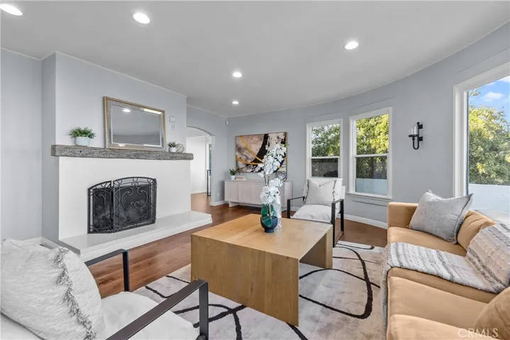 The living room brings the Art Deco influence of the era with the circular wall and dramatic views from the picture windows that frame the Pacific Ocean, the harbors, mountains, and the city.