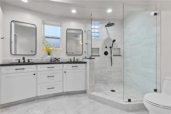 The spa-like bath is a relaxing retreat with gorgeously styled features.