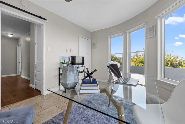 Bedroom #2 is filled with light and charm with its Art Deco style.