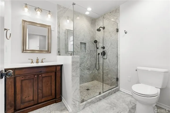 Bathroom #2 is beautifully remodeled with a large walk-in shower.