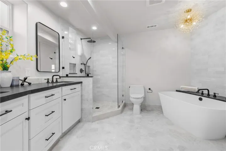 The spa-like bath is a relaxing retreat with gorgeously styled features.