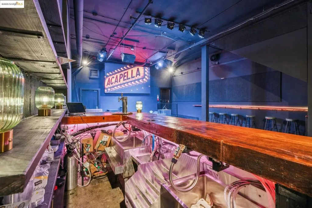 Playroom with a community bar and concrete flooring