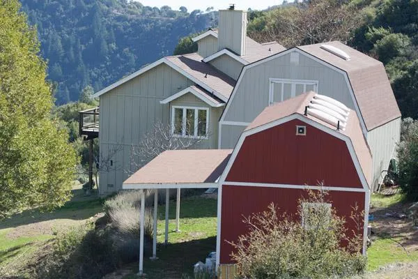 Main home and barn before the fire, a chance to rebuild and reimagine your mountain retreat.