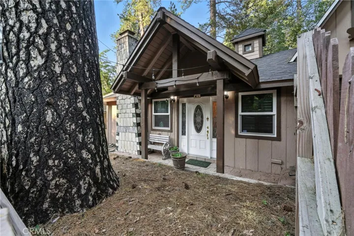 Front of home inside intial wooden security gate