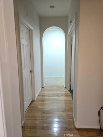 Hallway to bonus room, laundry, full bath, two bedrooms