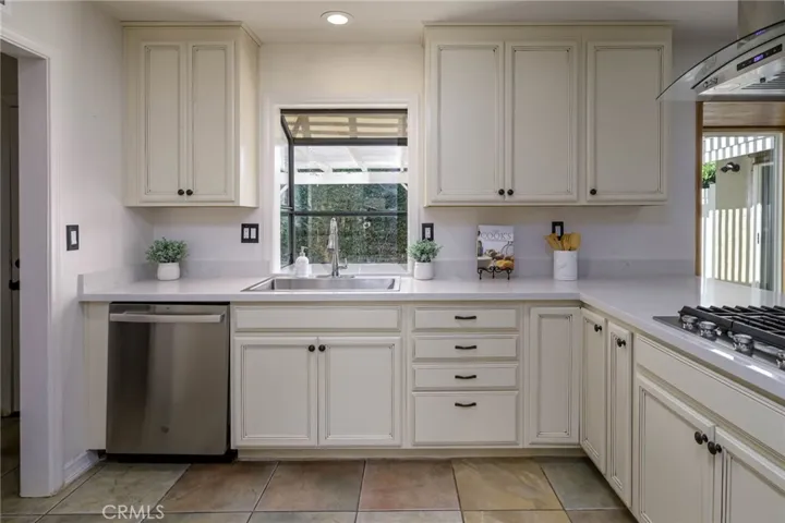 Main House - Remodeled Kitchen with window looking out to the backyard