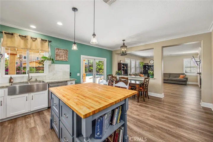 Eat-in butcher block island dining niche and open concept to family room