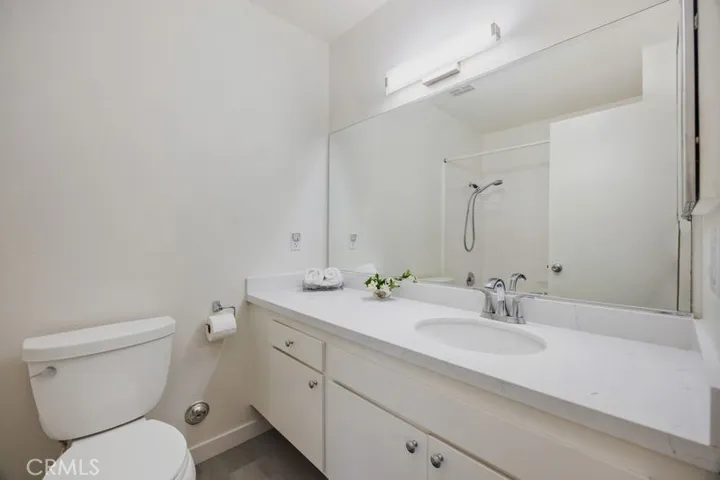 Secondary Bath Vanty with New Quartz Counter and fixture