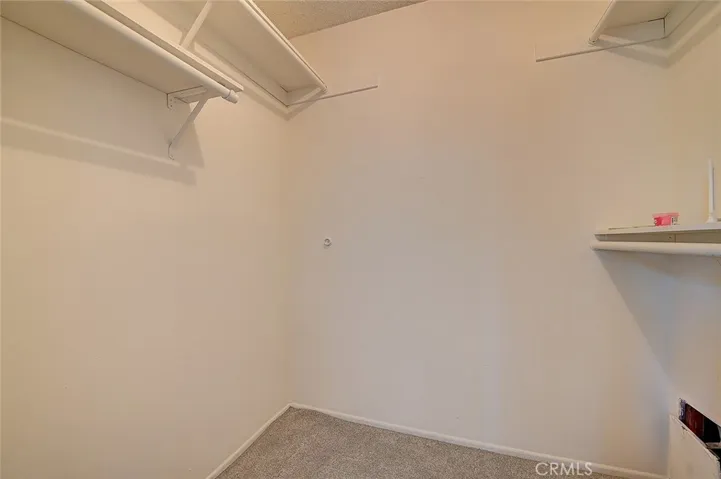 Upstairs back bedroom has a walk in closet.