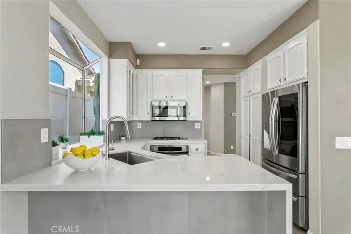 Kitchen w/ Counter Bar, Dining Room through Doorway