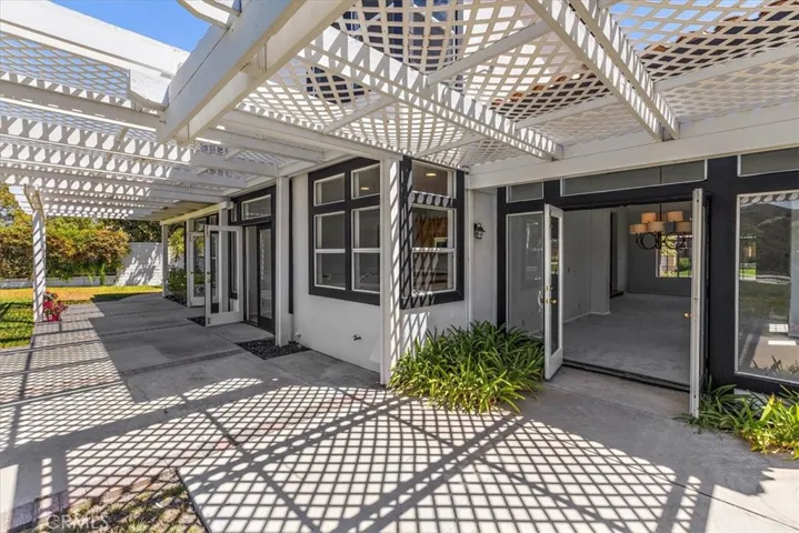Inviting backyard lattice covered patio